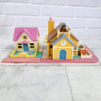 
              Polly Pocket Pollyville Bundle Cozy Cottage + School House (Light Up)
            