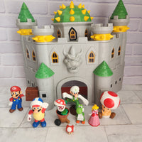 
              Super Mario Deluxe Bowser’s Castle Playset with Figures Bundle
            