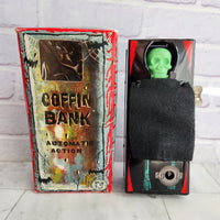 
              Wind Up Coffin Money Bank Original 1960 - Made In Japan - Mechanical Boxed Yone
            