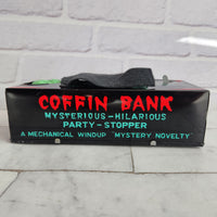 
              Wind Up Coffin Money Bank Original 1960 - Made In Japan - Mechanical Boxed Yone
            