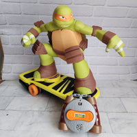 
              TMNT Skateboarding Mikey RC Michelangelo + Remote Control Ninja Turtles JAKKS
            