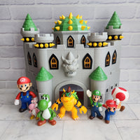 
              Super Mario Deluxe Bowser’s Castle Playset with Figures Bundle
            