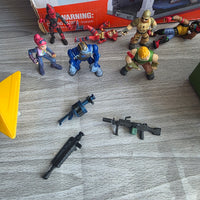
              Fortnite Bundle Squad vs Squad Playset + Figures Weapons + Golf Cart
            